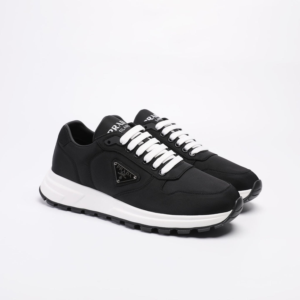 PRADA Navy Triangle Badge Sneakers — front
